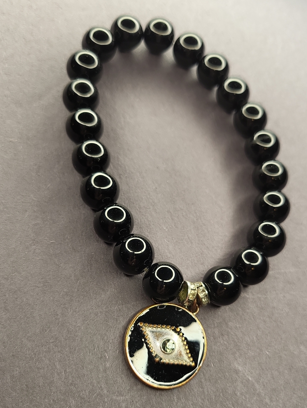 Black Beaded Stretch Bracelet with Gold Evil Eye Charm